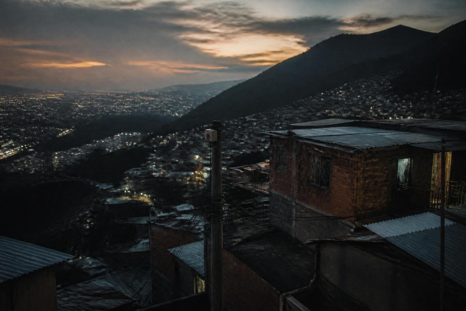 Dusk over a hillside settlement